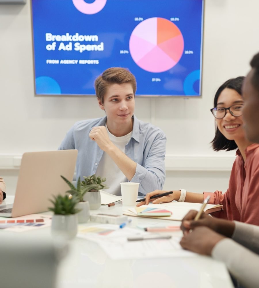 young people discussing marketing in meeting